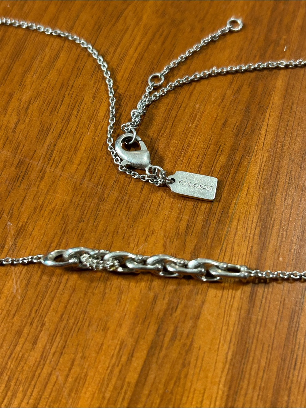 Coach Silver-Tone Chain Necklace with Tag and Horseshoe C Logo Link Accent Pave